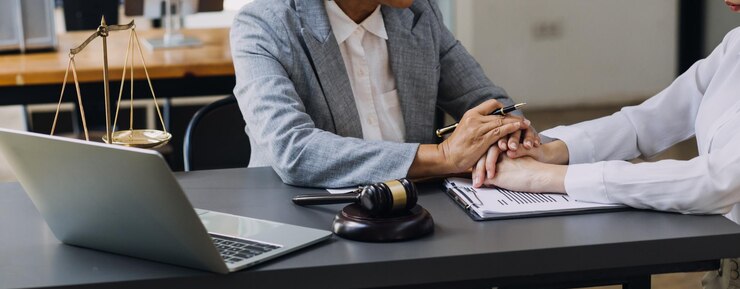 Injury lawyer Edvin Jones reviewing personal injury case to identify liable parties and maximize compensation for client.