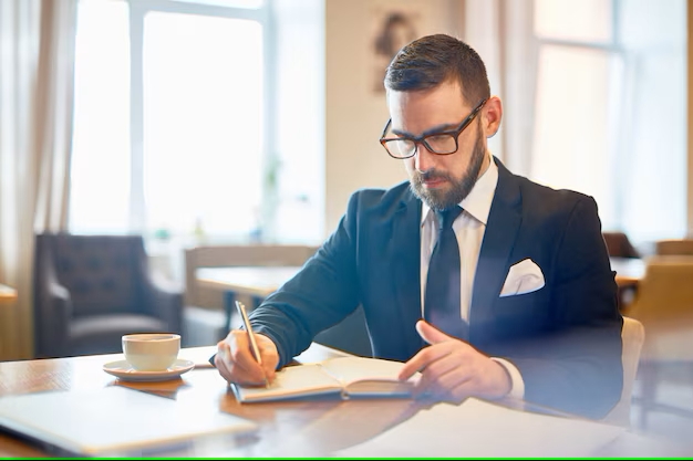 Professional lawyer in suit reviewing case files, symbolizing dedication to personal injury law.